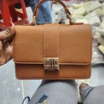Chic Brown Leather Handbag with Gold Accents